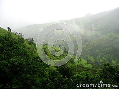 Monsoon clouds on a hill top Stock Photo