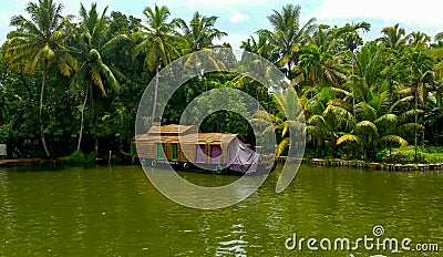 Scenic Houseboat on the backwaters during monsoon in Alleppey, Kerala, India Editorial Stock Photo