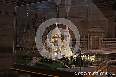 A miniature replica model of the Montmarte Basilica is displayed inside the church Editorial Stock Photo