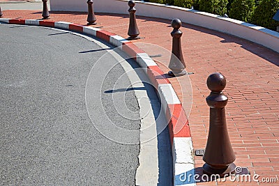 Monte Carlo street curve with formula one red and white signs detail in a summer day in Monte Carlo, Monaco Stock Photo