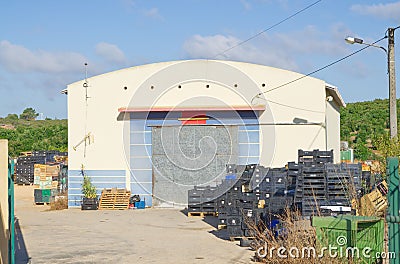 Monte Judeu, Lagos, Portugal August 16 2022: Avocado farm warehouse the new green gold empty crates Editorial Stock Photo