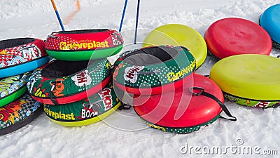 Monte Pora, Italy. Colorful rubber or plastic ski ring to slide on the snow. Fun in the winter season Editorial Stock Photo