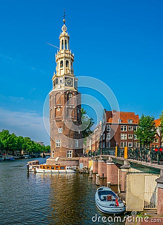 The Montelbaanstoren Tower in Amsterdam Editorial Stock Photo