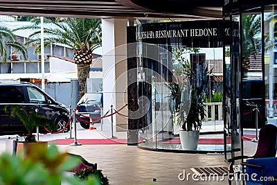 Montenegro, Budva - June, 27, 2017: Entrance to the restaurant with a revolving door made of glass Editorial Stock Photo