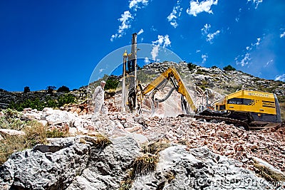 Montenegro, Cetinje - June, 29, 2017:Construction machinery CAT for crushing stone Editorial Stock Photo