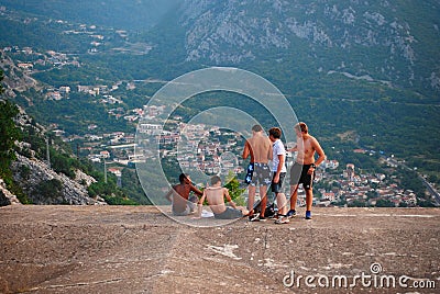 Montenegro, Kotor - 26 July, 2015: Young people rest on the roof Editorial Stock Photo