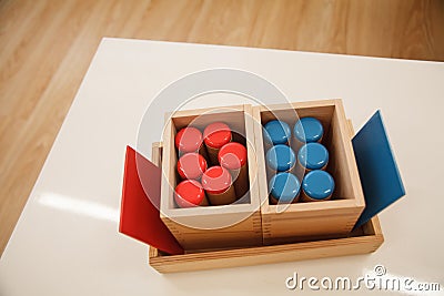 Montessori material noisy cylinders in classroom. Stock Photo