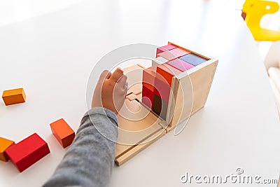 Montessori student hands using sensory materials in a school Stock Photo