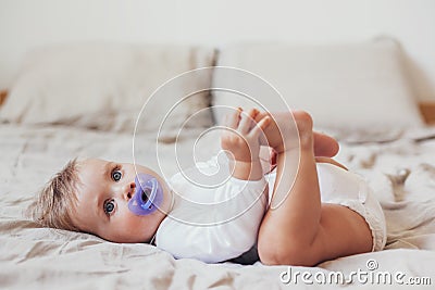 8 month baby with nipple Stock Photo
