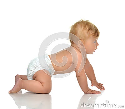 6 month infant child baby toddler sitting or crawling looking at Stock Photo