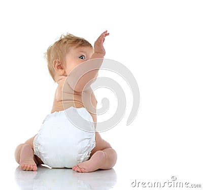 6 month infant child baby toddler sitting with raised hand up Stock Photo