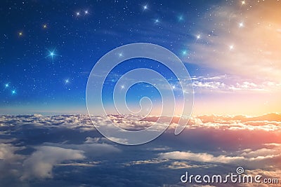 the month and the stars above the cumulus clouds in the rays of the setting sun a fantastic view of the world. Stock Photo