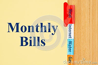 Monthly Bills type message on yellow file tabs Stock Photo