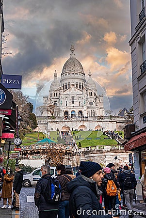 Montmartre shopping district and Sacre Coeur cathedral with tourists Editorial Stock Photo