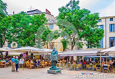 MONTPELLIER, FRANCE, JUNE 25, 2017: People are sitting at restaurants at Place jean Jaures in the center of Montpellier, France Editorial Stock Photo