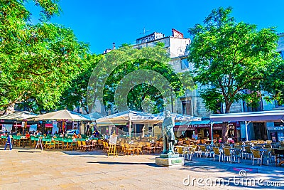 MONTPELLIER, FRANCE, JUNE 26, 2017: People are sitting at restaurants at Place jean Jaures in the center of Montpellier, France Editorial Stock Photo