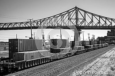 Montreal BW port scene with trains containers and bridge Stock Photo
