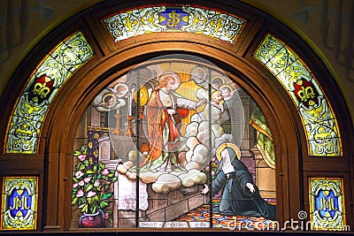 Stained glass window of Saint Joseph Oratory of Mount Royal Crypt Editorial Stock Photo