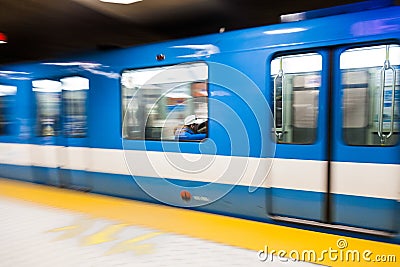 Montreal Metro Train with Motion Blur Editorial Stock Photo