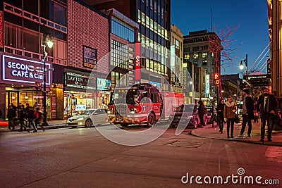 Montreal, Quebec, Canada - March 11, 2016: Evening in downtown Montreal city, early sunset. Image can have grain or noise when vie Editorial Stock Photo