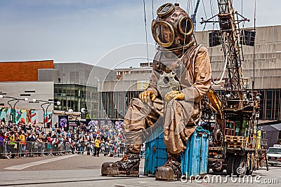 Montreal, Quebec, Canada - May 21, 2017:Sleeping deep-sea diver giant marionette Editorial Stock Photo