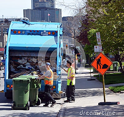 Operating garbage truck Editorial Stock Photo