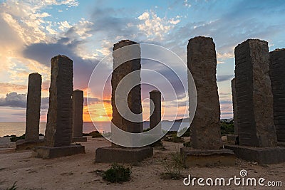 Ibiza, Spain; October 23 2021: Beautiful sunset near the Stonege monument of Ibiza at Cala Llentia Editorial Stock Photo