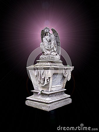 Monument an angel on a background of mystical light Stock Photo