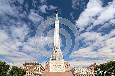 Monument of freedom. woman holding three gold stars which symbolise three regions of Latvia Stock Photo