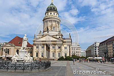 Berlin, Gendarmenmarkt. Historic buildings with French Cathedral and Schiller Monument.on square Gendarmenmarket. Editorial Stock Photo