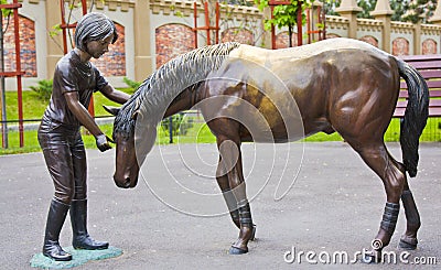 Monument girl and horse Stock Photo