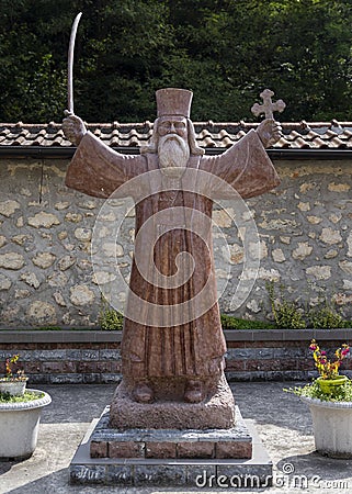 Monument of Hadzi Milentije at medieval monastery Raca at Tara mountain in Serbia Stock Photo