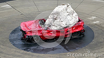 Monument of a huge stone on a crashed red car, Australia. Editorial Stock Photo