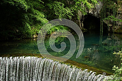Monument of nature, spring of river Krupaja or Krupajsko vrelo with underwater cave. Beautiful natural oasis and tourist Stock Photo