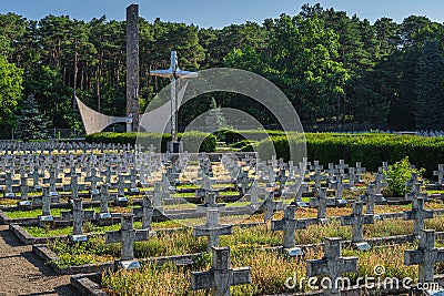 Monument and rows of graves. Military cemetery for fallen soldiers from 1st Polish Army Editorial Stock Photo