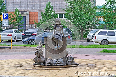 Monument to the heroes of the fairy tale Lewis Carroll `Alice in Wonderland`. Together with Alice Cheshire Cat and March Rabbit Editorial Stock Photo