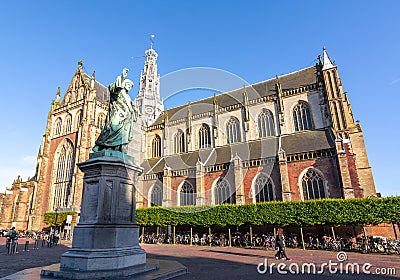Monument to Laurens Janszoon Coster and Cathedral of St. Bavo on Market square, Haarlem, Netherlands Editorial Stock Photo