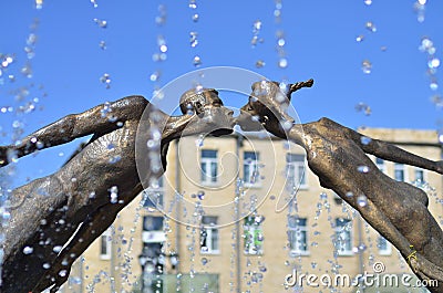 Monument to lovers in Kharkov, Ukraine - is an arch formed by the flying, fragile figures of a young man and a girl, merged into Stock Photo