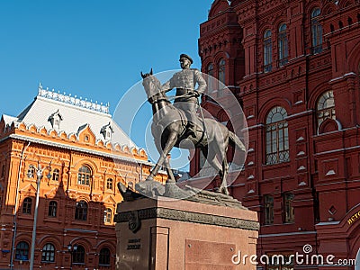 Monument to Marshal Zhukov on Manezhnaya Square against the background of the Historical Museum. Translation of inscription: Editorial Stock Photo