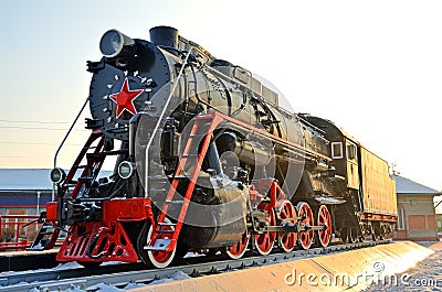 Monument to the old steam locomotive. Such steam locomotives were used in the first half of the 20th century, in the Soviet Union Stock Photo