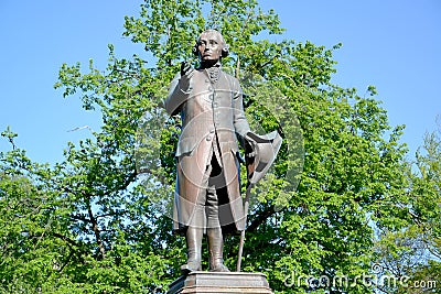 Monument to the philosopher Immanuel Kant against the background of foliage. Kaliningrad Stock Photo