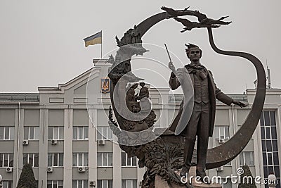 a monument to the poet and a flag of Ukraine on the house Editorial Stock Photo
