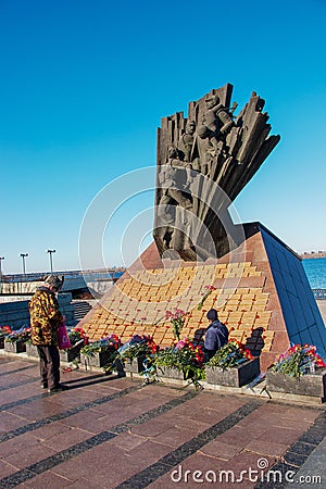Monument to veterans of the Afghan war 1979-1989. Red carnations on the granite slab of the monument. People honor the memory of Editorial Stock Photo