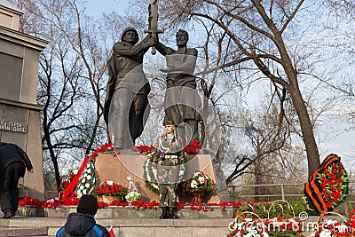 Monument `Union of the front and rear` during the celebration of Victory Day WWII near the Victory Memorial building. Editorial Stock Photo