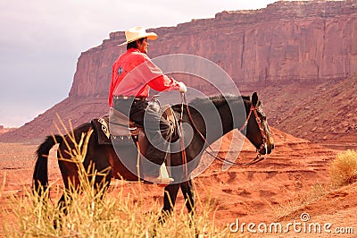 Monument Valley , Utah - September 12: Monument Valley Tribal Park in Utah USA on September 12, 2011. Cowboy on horse in famous tr Editorial Stock Photo