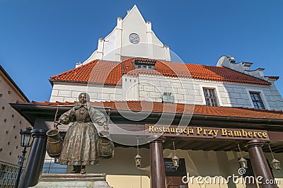 Monument of woman with two water or wine jugs Bamberka statue on Old Market Square in Poznan, Poland Editorial Stock Photo