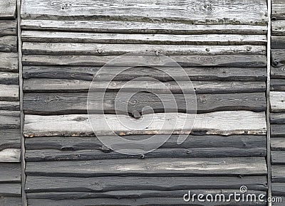 Monumental Fence from Horizontal cuts of wood boards treated with creosote. The texture of the annual stripes of a tree. Image for Stock Photo