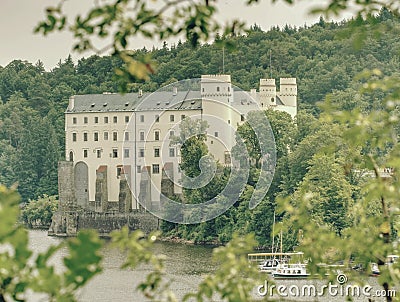 Monumental medieval gothic Orlik castle above Orlik dam Editorial Stock Photo