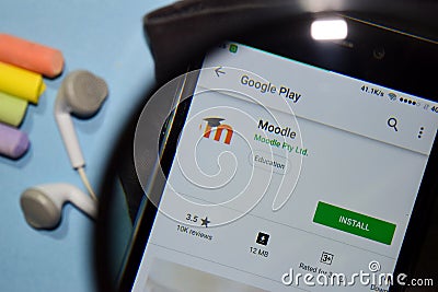 Moodle dev app with magnifying on Smartphone screen. Editorial Stock Photo