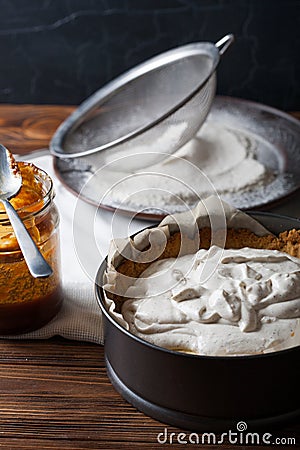 Moody Banoffee pie closeup with caramel on the wooden table Stock Photo